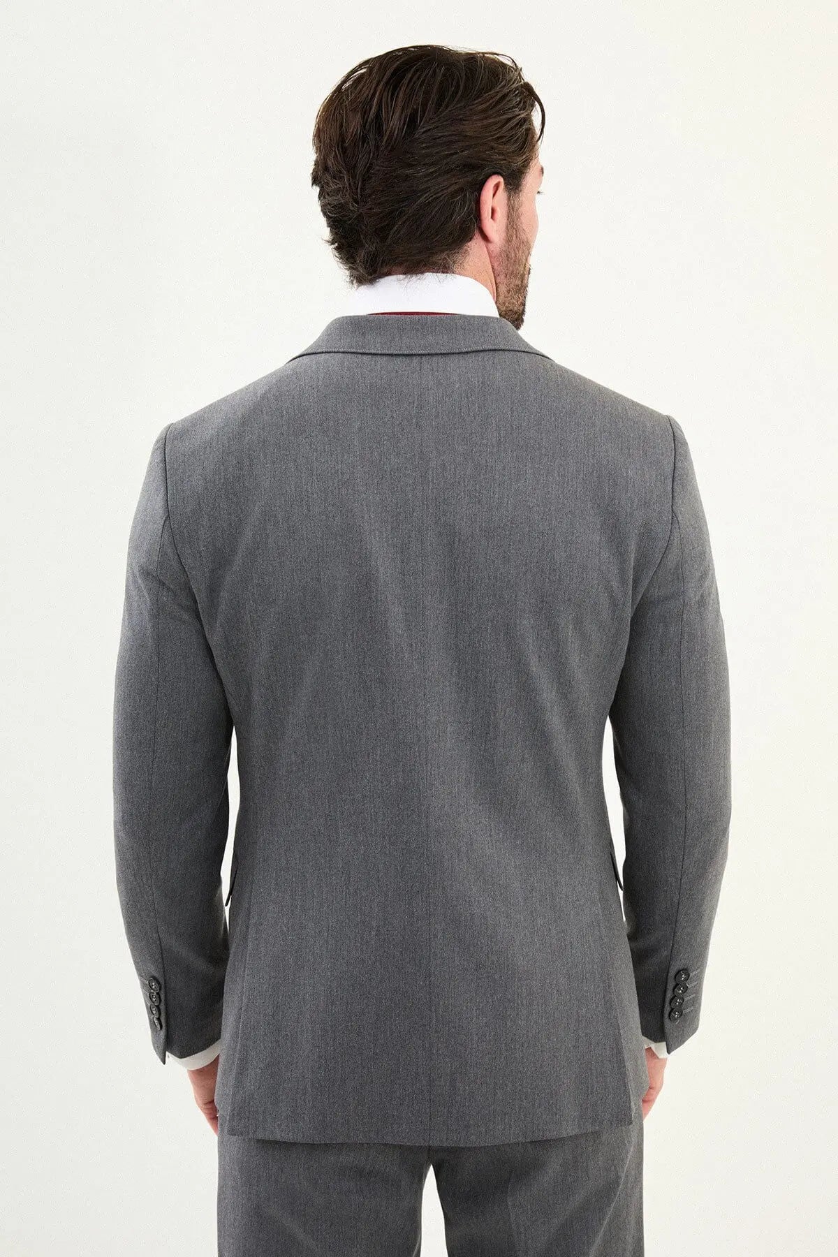 Men’s micro-heathered gray slim-fit three-piece winter suit with single-breasted 2-button jacket, 5-button waistcoat, notch lapels with AMF stitching, and black origami lapel pin.