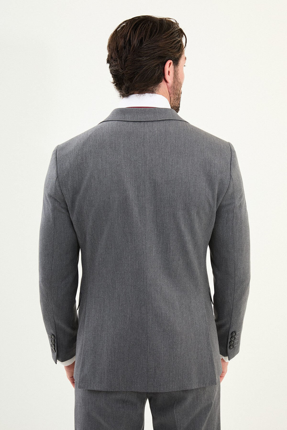 Men’s micro-heathered gray slim-fit three-piece winter suit with single-breasted 2-button jacket, 5-button waistcoat, notch lapels with AMF stitching, and black origami lapel pin.