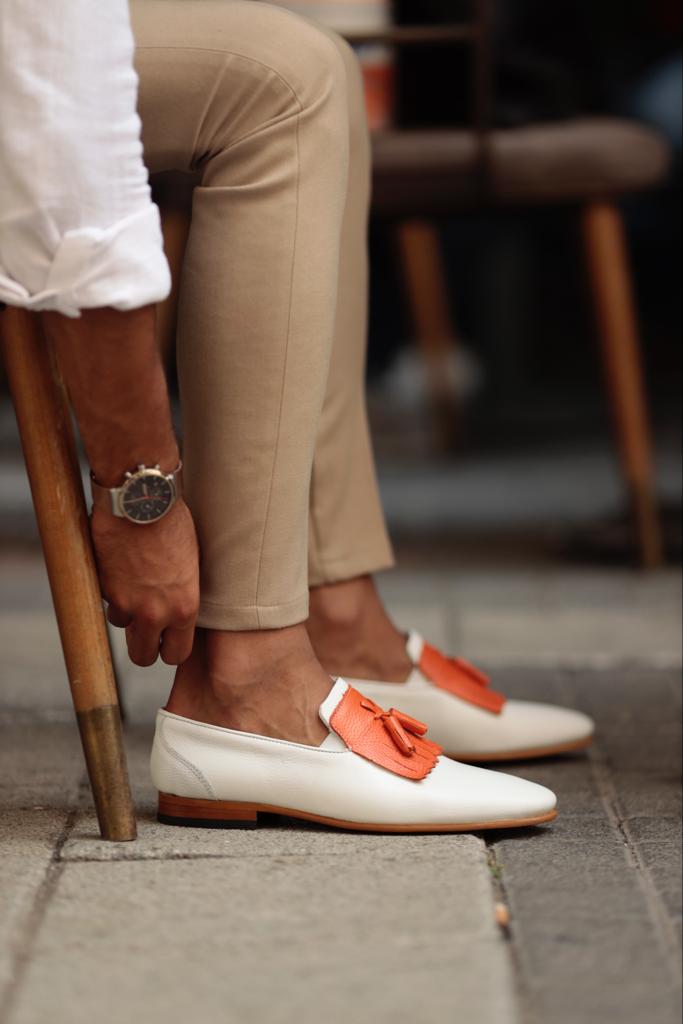 Empire White Kilt Tassel Slip-Ons: Elegance Redefined