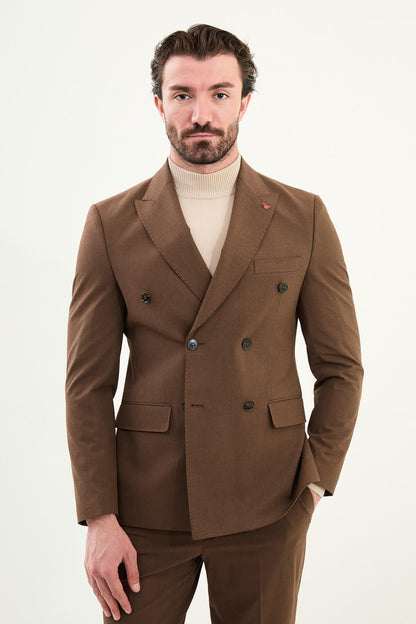 Men’s deep brown slim-fit double-breasted 6x2 suit with peak lapels and patch pockets, cotton-wool-viscose blend with 4-way stretch for wrinkle-resistant wear, styled with a cream turtleneck.