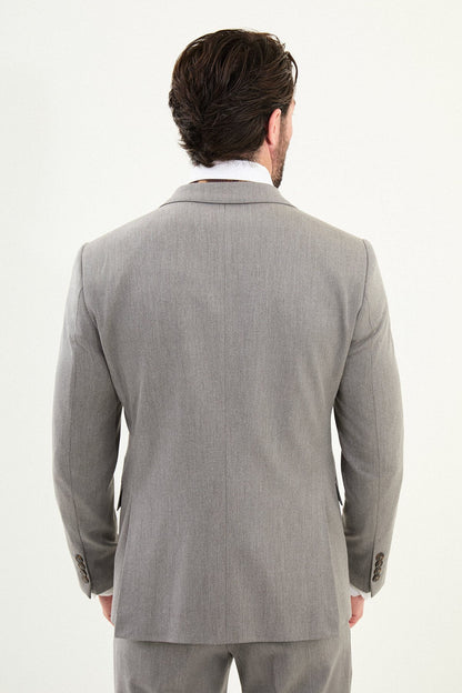 Men’s light gray slim-fit three-piece wool-blend winter suit with single-breasted jacket, notch lapels, matching waistcoat, dark buttons, and black origami lapel pin.